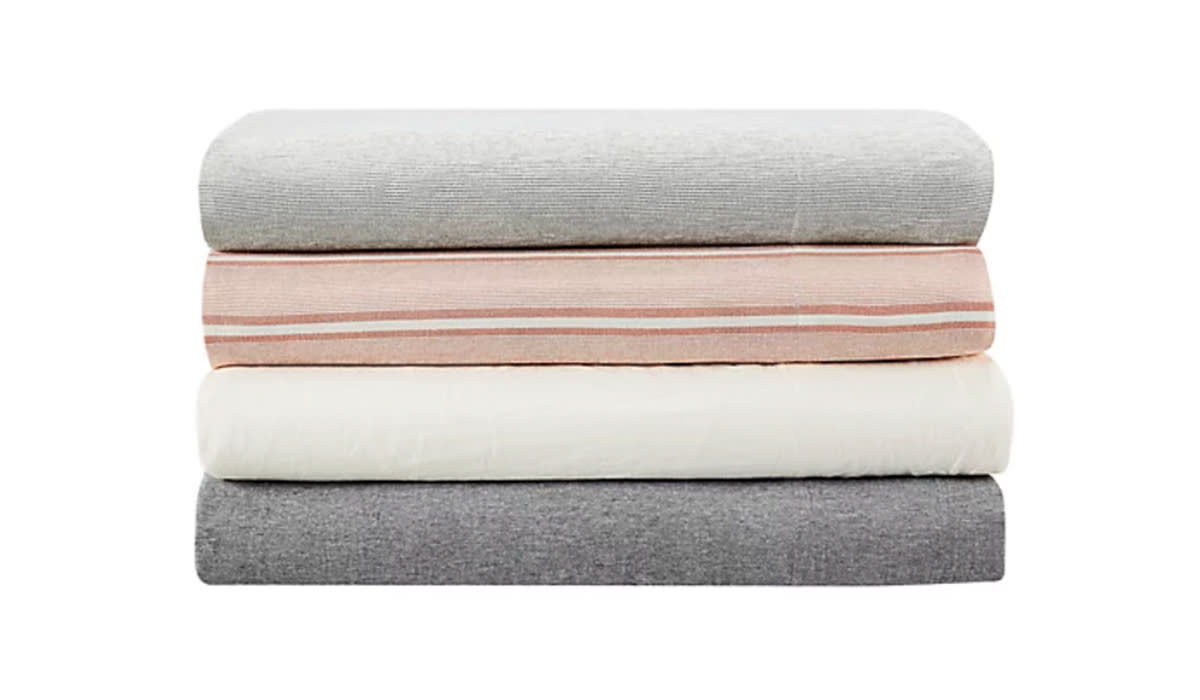 Stack of sheets in assorted colors/patterns