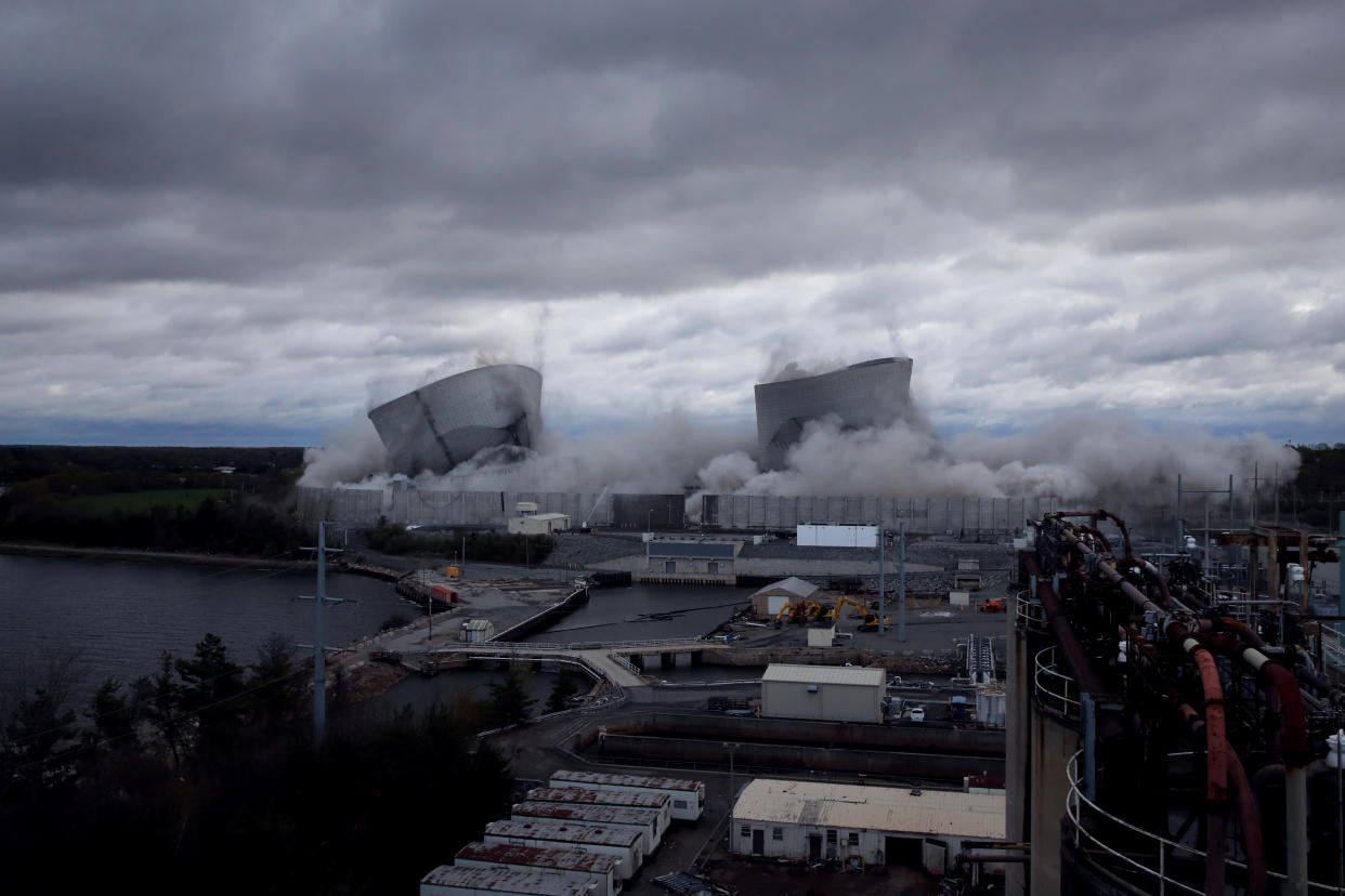 The two towers soon after the demolition, surrounded by smoke.