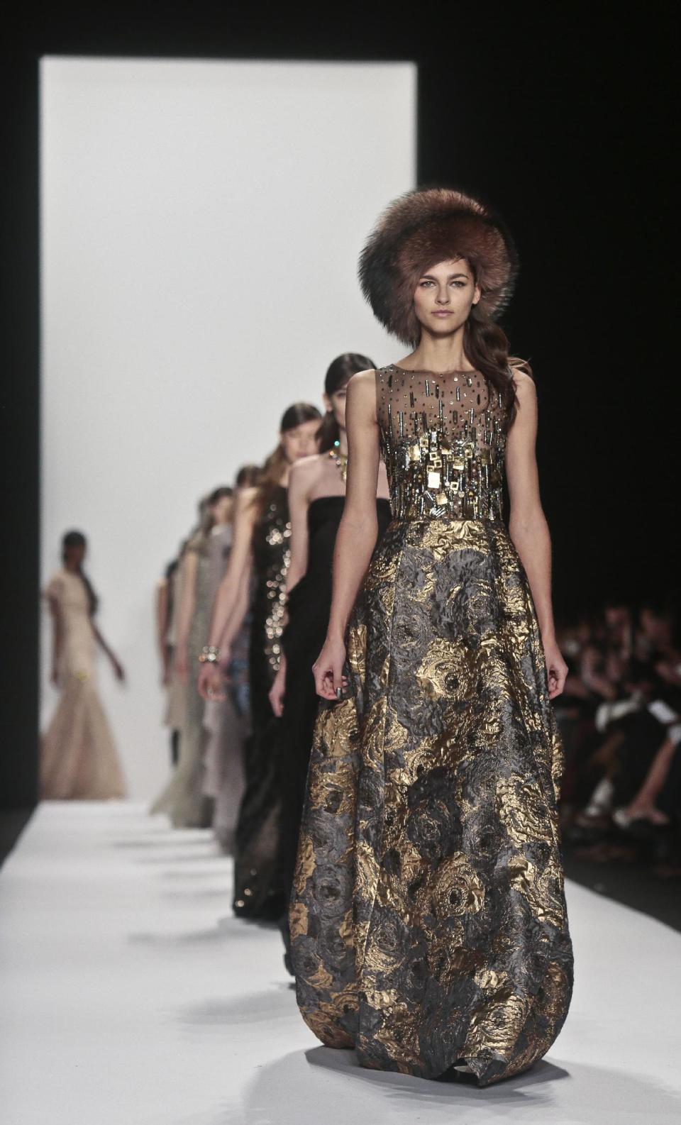 Fashion from the Badgley Mischka Fall 2014 collection is modeled during New York Fashion Week on Tuesday, Feb. 11, 2014. (AP Photo/Bebeto Matthews)