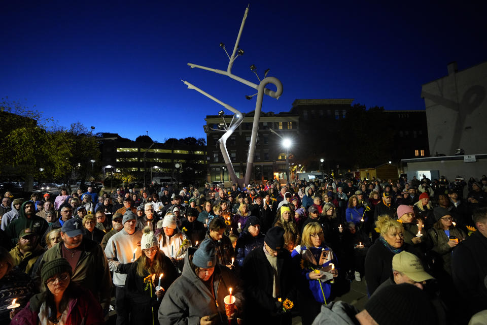 Community members gather Thursday, Nov. 2, 2023, during a candlelight vigil in Auburn, Maine. Locals seek a return to normalcy after a mass shooting in Lewiston on Oct. 25. (AP Photo/Matt York)