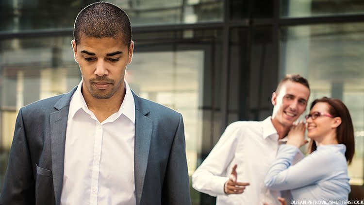 Person being mocked by two coworkers