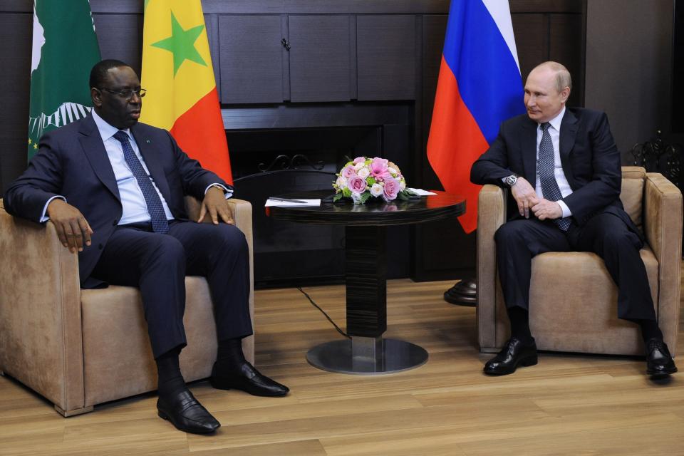 Russian President Vladimir Putin, right, speaks to Senegalese President and the chairman of the African Union Macky Sall during their meeting in the Bocharov Ruchei residence in the Black Sea resort of Sochi, Russia, Friday, June 3, 2022. (Mikhail Klimentyev, Sputnik, Kremlin Pool Photo via AP)