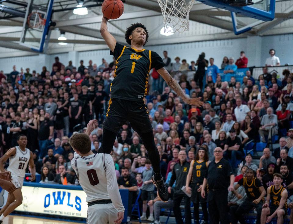 Archbishop Wood's Jalil Bethea (1) goes up for an emphatic dunk in the PIAA state playoff win over Lower Merion.