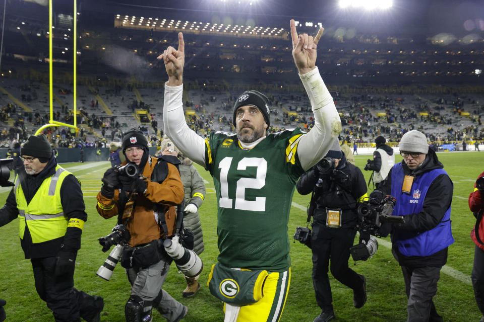 Green Bay Packers quarterback Aaron Rodgers (12) waves to fans as he leaves the field following an NFL football game against the Los Angeles Rams in Green Bay, Wis. Monday, Dec. 19, 2022. The Packers defeated the Rams 24-12. (AP Photo/Mike Roemer)