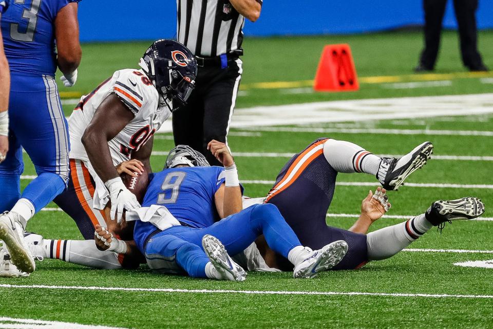 Detroit Lions quarterback Matthew Stafford is tackled by Chicago Bears defensive tackle Akiem Hicks (96) during the second half at Ford Field, Sunday, Sept. 13, 2020.