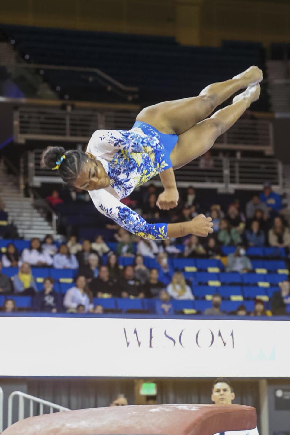 UCLA's Selena Harris performs on the vault during a dual meet against Utah on Monday.