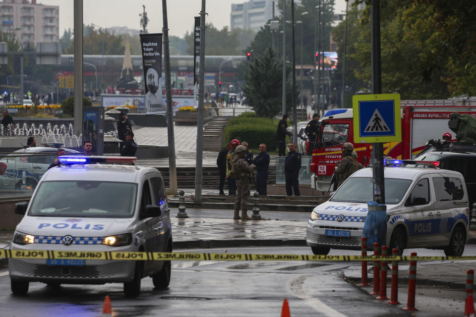 Turkish security forces cordon off an area after an explosion in Ankara, Sunday, Oct. 1, 2023. A suicide bomber detonated an explosive device in the heart of the Turkish capital, Ankara, on Sunday, hours before parliament was scheduled to reopen after a summer recess. A second assailant was killed in a shootout with police. (AP Photo/Ali Unal)