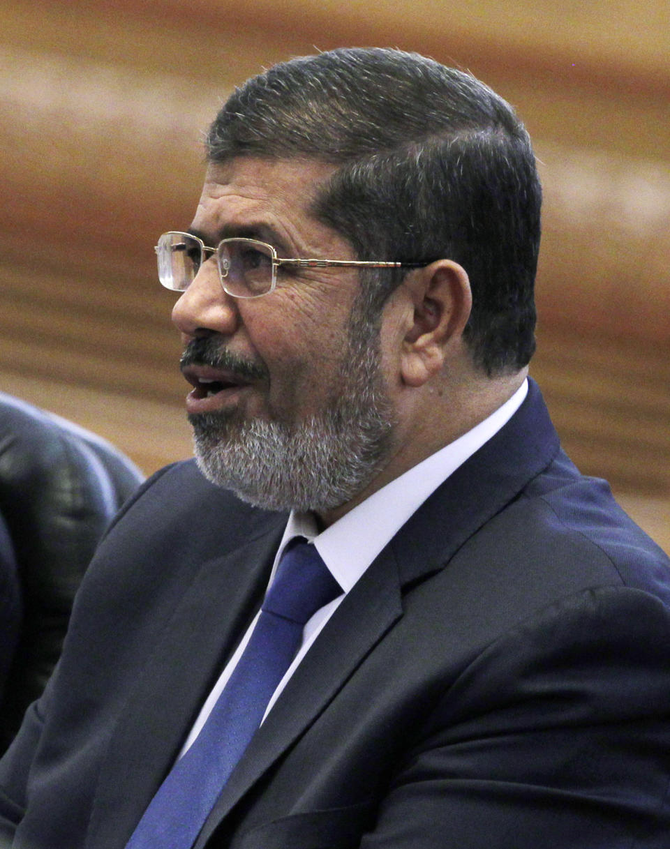 Egypt's President Mohammed Morsi speaks to his Chinese counterpart Hu Jintao, not in photo, during their meeting at the Great Hall of the People in Beijing, China, Tuesday, Aug. 28, 2012. China is hosting Egypt's newly elected president despite its uneasiness with the Arab Spring revolution that helped bring him to power, while the new leader seeks to shore up his country's flagging economy. (AP Photo/How Hwee Young, Pool)