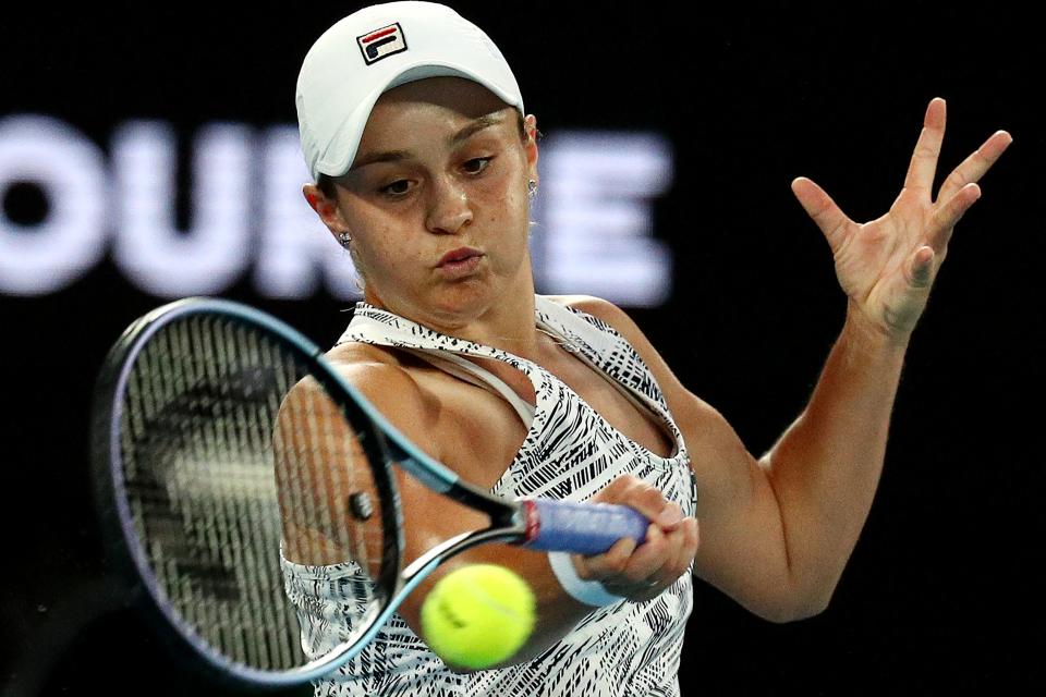 Australia's Ashleigh Barty hits a return against Danielle Collins in the Australian Open women's final. (Photo by AARON FRANCIS/AFP via Getty Images)