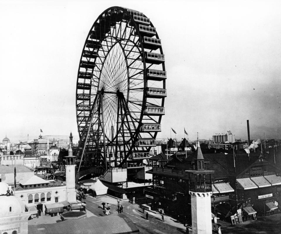 In this May 1893 photo, the first Ferris wheel, which was capable of carrying 1,400 persons, and rose 250 feet into the air, looms over the grounds of the 1893 World's Columbian Exposition in Chicago, Ill. (AP Photo)