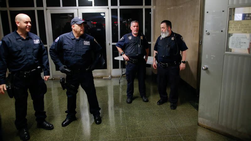 New York State Court policemen stand guard at the courtroom during film producer Harvey Weinstein's sentencing for sexual assault following his trial at New York Criminal Court in the Manhattan borough of New York City