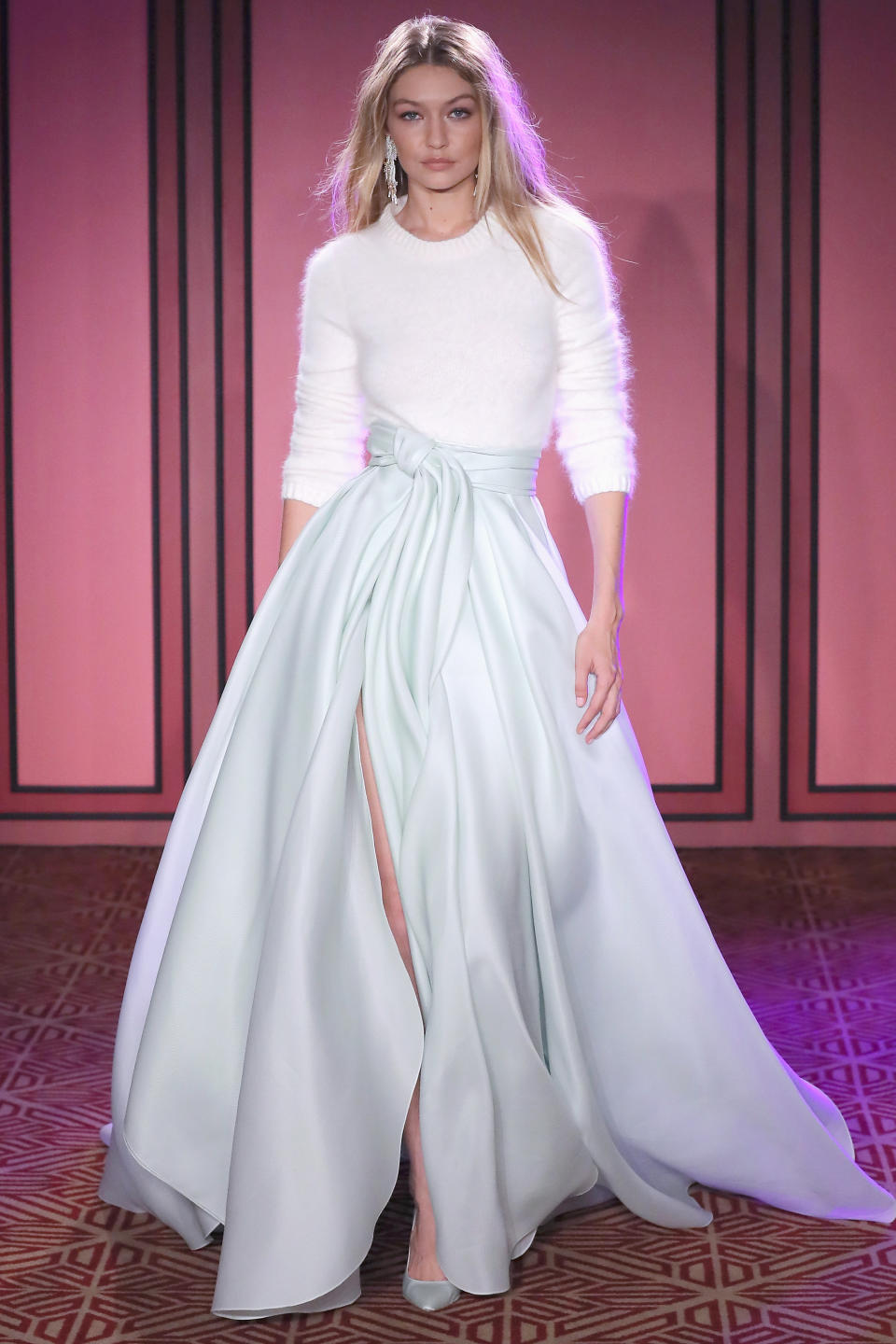 <p>The supermodel looked ethereal in a white sweater and dramatic skirt at Brandon Maxwell.</p>