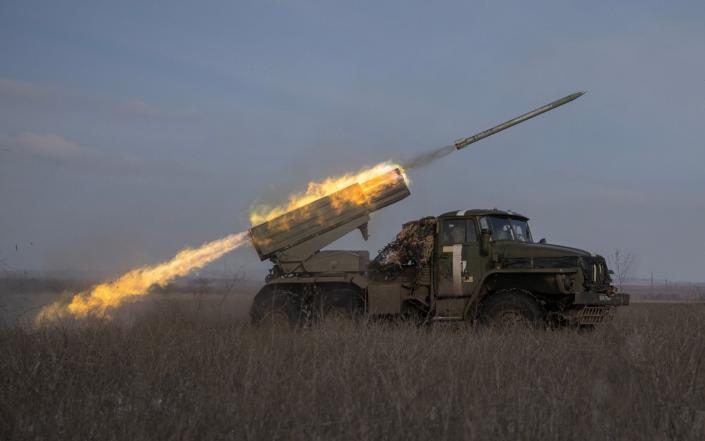 Ukrainian servicemen fire a BM-21 Grad multiple launch rocket system towards Russian positions - REUTERS/Marko Djurica