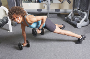 <div class="caption-credit"> Photo by: getty</div><b>Plank row Works:</b> middle back, lats, core, arms A. Get into plank or push-up position, with hands directly under shoulders and a dumbbell beside each hand. Keep your spine straight, with a slight natural curve, from the top of your head to your tailbone-don't let your back collapse. Pull your belly button in toward your spine and keep your core engaged. B. Keeping your elbow close to the body, lift one dumbbell toward the ribcage until the elbow passes your back. Keep the abdominals tight and avoid moving the whole body. C. Return to starting position and repeat with the opposite side. This equals one repetition.