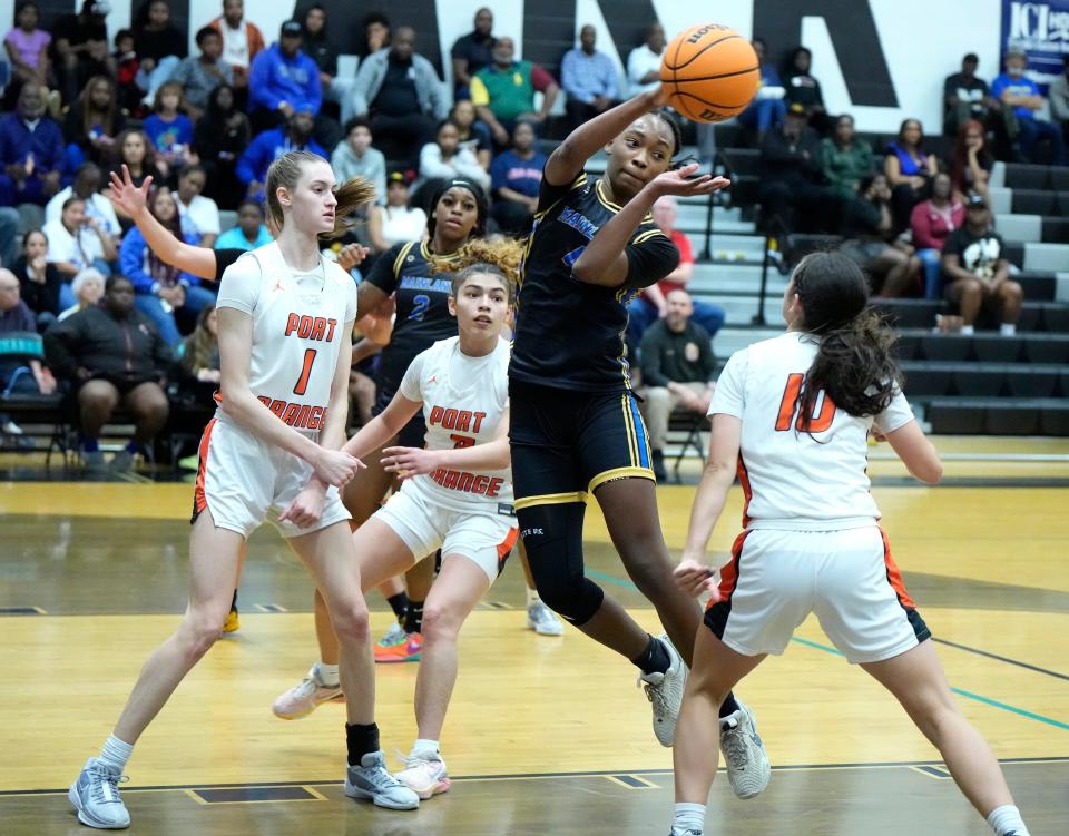 Mainland's Anovia Sheals (4) tosses a pass to the corner against Spruce Creek during the Five Star Conference Tournament finals at Atlantic High School in Port Orange, Friday, Jan. 26, 2024.