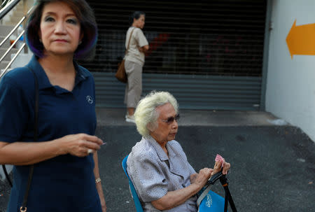 People wait at a polling station to cast their vote in the general election in Bangkok, Thailand, March 24, 2019. REUTERS/Soe Zeya Tun