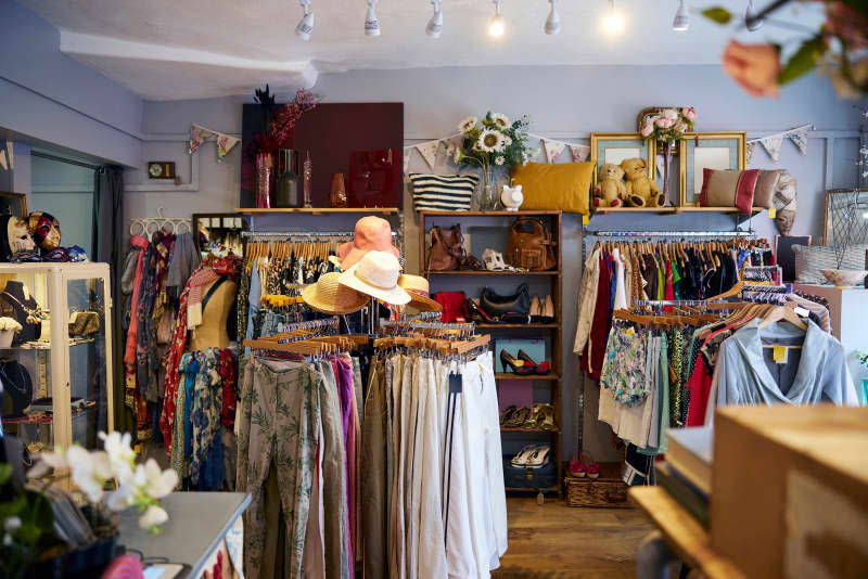 Interior Of Charity Shop Or Thrift Store Selling Used And Sustainable Clothing And Household Goods