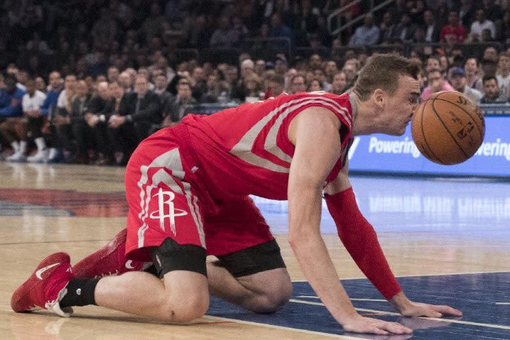 CORRECTS TO SAM DEKKER, INSTEAD OF MONTREZL HARRELL - Houston Rockets' Sam Dekker trips and falls during the first half of the team's NBA basketball game against the New York Knicks, Wednesday, Nov. 2, 2016, at Madison Square Garden in New York. (AP Photo/Mary Altaffer)