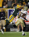 GREEN BAY, WI - SEPTEMBER 08: Randall Cobb #18 of the Green Bay Packers dives into the endzone for a touchdown against Jabari Greer #33 of the New Orleans Saints during the season opening game at Lambeau Field on September 8, 2011 in Green Bay, Wisconsin. (Photo by Jonathan Daniel/Getty Images)