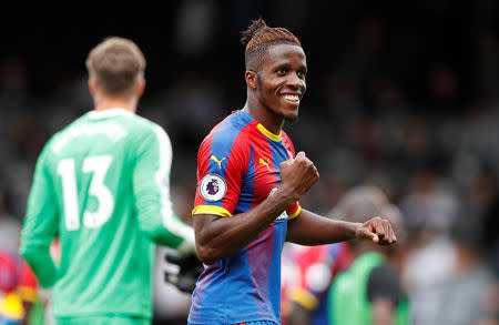 FILE PHOTO: Soccer Football - Premier League - Fulham v Crystal Palace - Craven Cottage, London, Britain - August 11, 2018 Crystal Palace's Wilfried Zaha celebrates after the match Action Images via Reuters/John Sibley