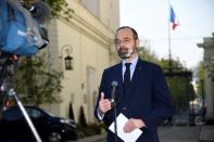 French Prime Minister Edouard Philippe speaks to the media at the Interministerial Crisis Coordination Unit outside the French Interior Ministry, as the spread of the coronavirus disease (COVID-19) continues, in Paris
