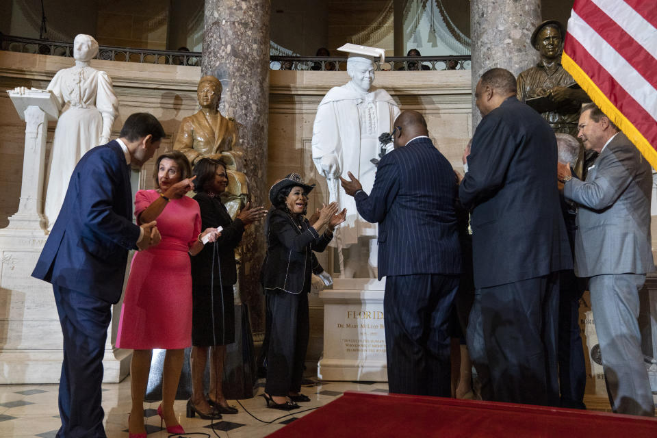 Speaker of the House Nancy Pelosi of Calif., second from left, gestures to Sen. Marco Rubio, D-Fla., as Rep. Val Demings, D-Fla., and Rep. Frederica Wilson, D-Fla., center, react along with members of the Florida Congressional Delegation, during the unveiling of a state statue from Florida of Mary McLeod Bethune, in Statuary Hall, Wednesday, July 13, 2022, at the U.S. Capitol in Washington. (AP Photo/Jacquelyn Martin)