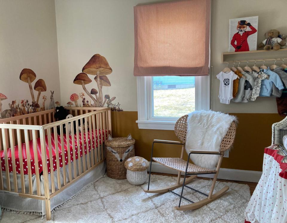 The nursery became a labor of love: I found woodland decor, hand-built wall shelves and my mom sewed custom shades for the windows.