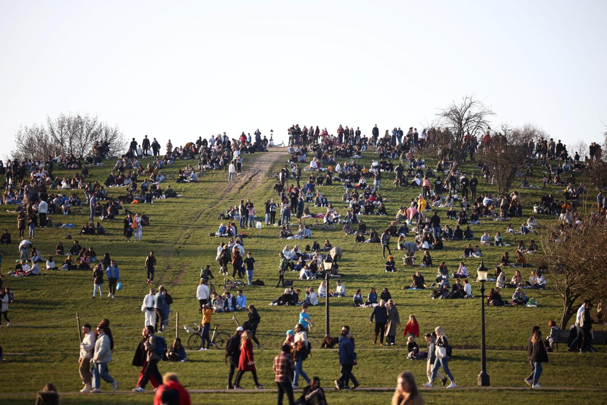 <p>People gather in their thousands in Primrose Hill</p> (Reuters)