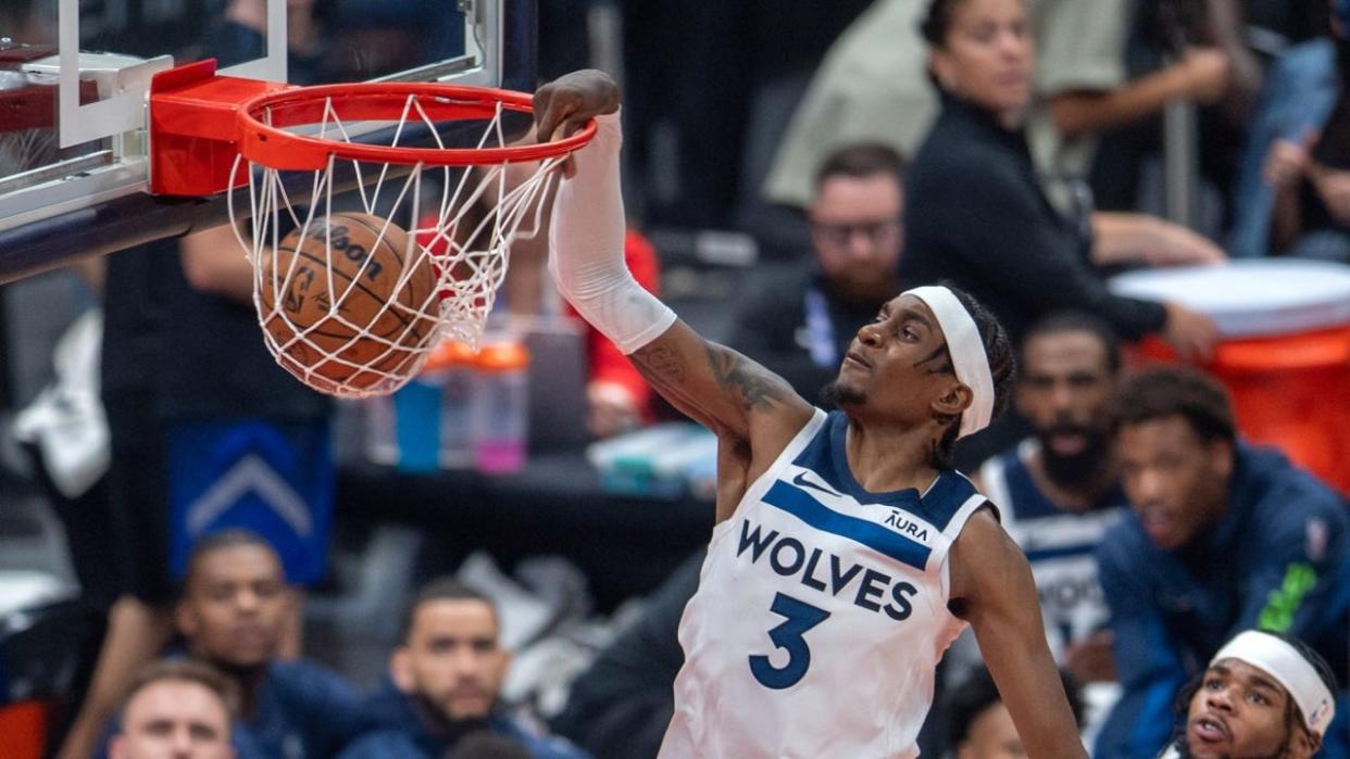 <div>Minnesota Timberwolves' forward Jaden McDaniels #3 dunks the ball during the NBA Preseason game Between the Dallas Mavericks and the Minnesota Timberwolves at the Etihad Arena in Abu Dhabi on October 5, 2023.</div> <strong>((Photo by Ryan LIM / AFP) (Photo by RYAN LIM/AFP via Getty Images))</strong>