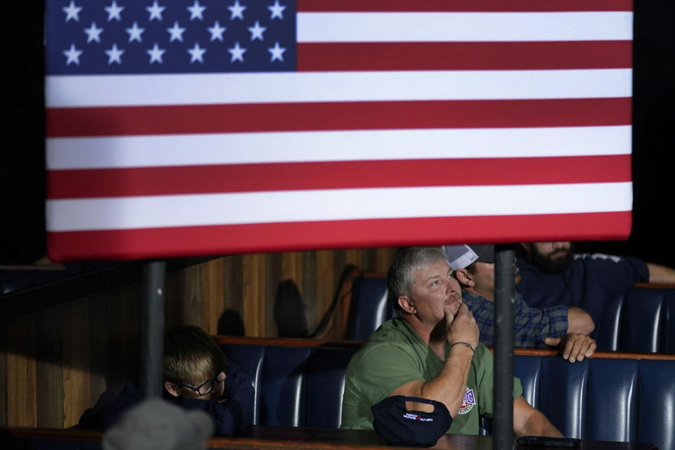 FILE - An audience member listens to Republican presidential candidate Florida Gov. Ron DeSantis speak during a meet and greet, Saturday, Oct. 14, 2023, in Creston, Iowa. Former President Donald Trump was the first choice of 51% of likely Iowa caucus participants in a Des Moines Register-NBC News-Mediacom Iowa Poll published Monday, Dec. 11. Florida Gov. Ron DeSantis, who has vowed that he will win Iowa, had the support of 19%. (AP Photo/Charlie Neibergall, File)