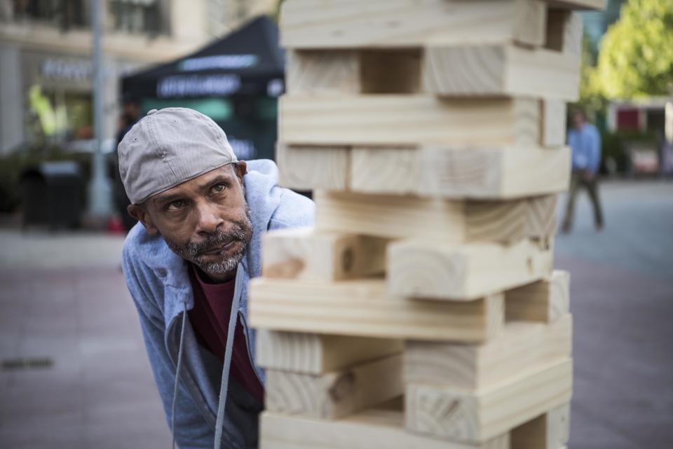 Elynn Royster plays jumbo Jenga.