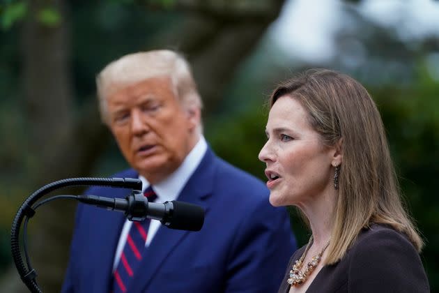 If you're trying to figure out how Donald Trump — shown here at a 2020 press conference in Washington — would approach reproductive rights, you'll find a pretty big clue in his appointment of conservative Supreme Court justices, such as Amy Coney Barrett, at right.