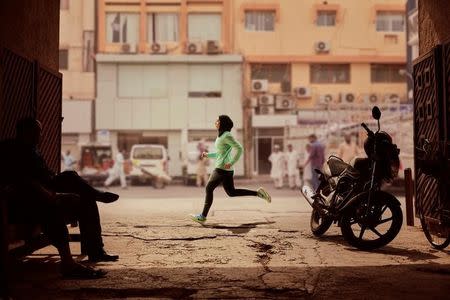 Zahra Lari runs in a scene shot for the Nike Middle East ad campaign filmed in Dubai, UAE, February 10, 2017. Picture taken February 10, 2017. Nike/Handout via REUTERS