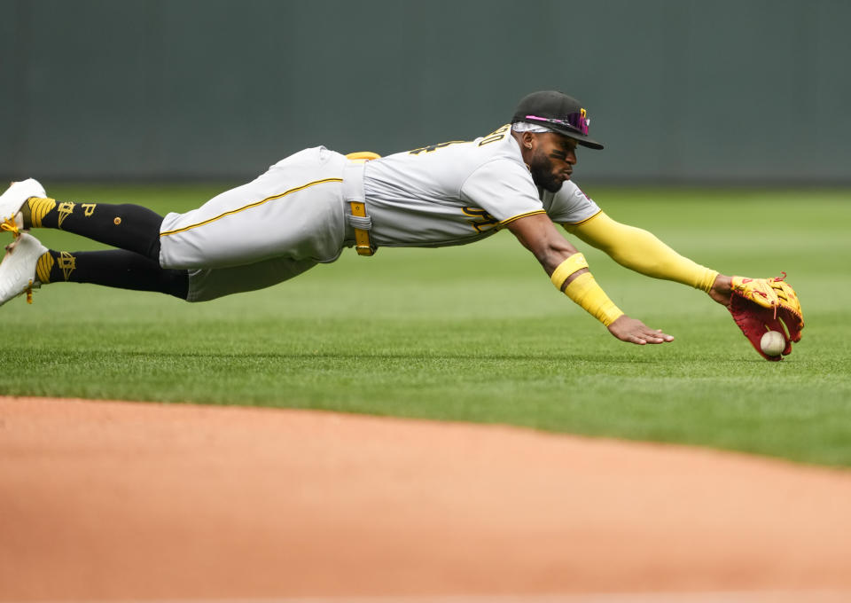 Pittsburgh Pirates second baseman Rodolfo Castro dives to field the single from Seattle Mariners' Julio Rodriguez during the third inning of a baseball game, Sunday, May 28, 2023, in Seattle. (AP Photo/Lindsey Wasson)