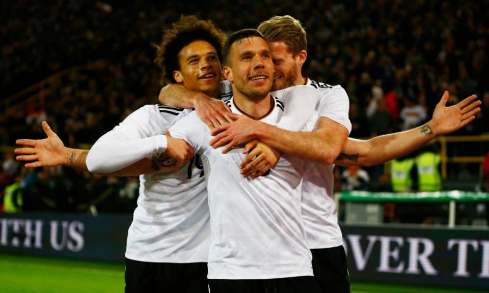 Lukas Podolski is congratulated by Leroy Sané and Andre Schürrle after scoring Germany’s winner against England.