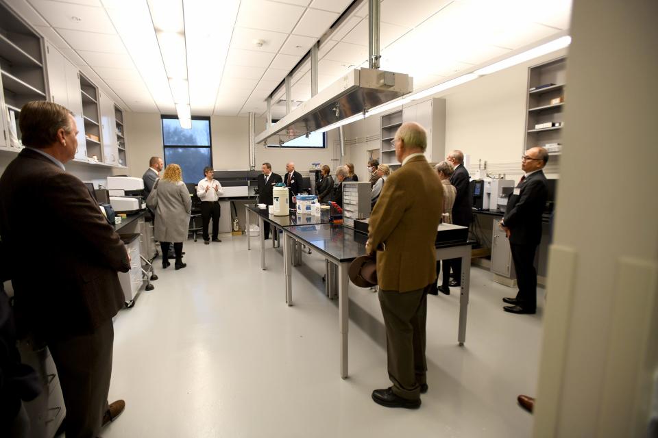 Guests take a tour of Walsh University's SPARQ Analytical Laboratory of Scientific Excellence following a luncheon and dedication on Tuesday.