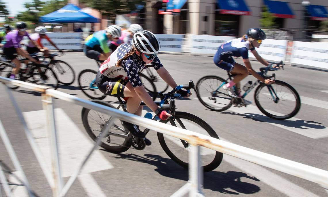 Boise resident Tessa Beebe, 13, rounds a corner in the women’s Cat 2-3-4 race during the Twilight Criterium in downtown Boise on Saturday. Beebe recently won national titles at the Amateur Road Bike Nationals for USA Cycling held in Roanoke, Virginia. At the Twilight Criterium, she took third place.