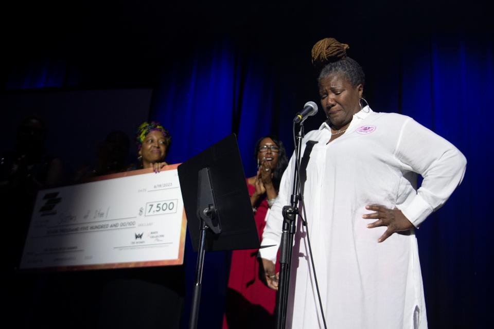 Emotions overwhelm Adrienne Goines after the announcement that Goines' pitch for Sistas of Steel Gun Club won the top prize of $7500 at the Crown Pitch Competition on Monday, June 19, 2023.