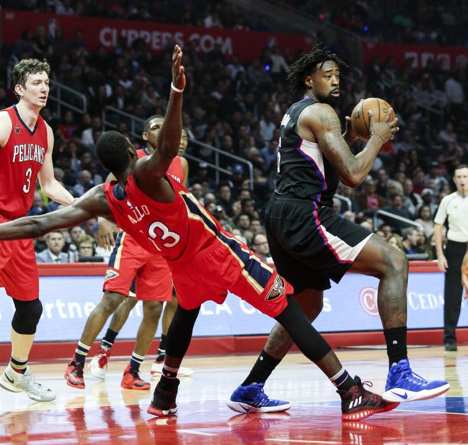 Los Angeles Clippers center DeAndre Jordan, right, dribbles against New Orleans Pelicans forward Cheick Diallo, left, during the first half of an NBA basketball game Saturday, Dec. 10, 2016, in Los Angeles. (AP Photo/Ringo H.W. Chiu)