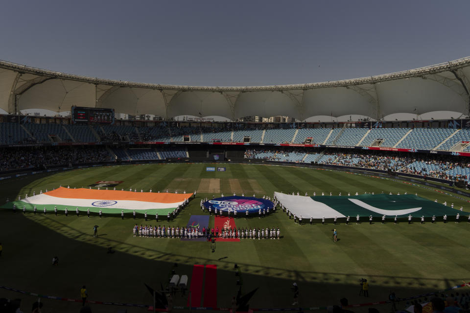 Indian, left, and Pakistan players stand for their national anthem before the start of the ICC Women's T20 World Cup 2024 match between Pakistan and India at Dubai International Stadium, United Arab Emirates, Sunday, Oct. 6, 2024. (AP Photo/Altaf Qadri)