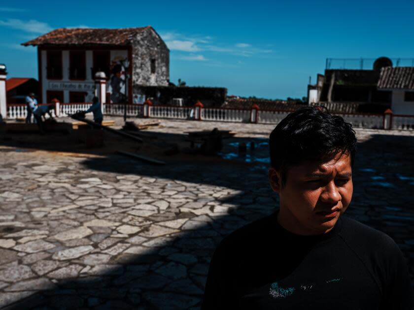 José Luis Hernández, standing in the shadow of the church in Cuetzalan