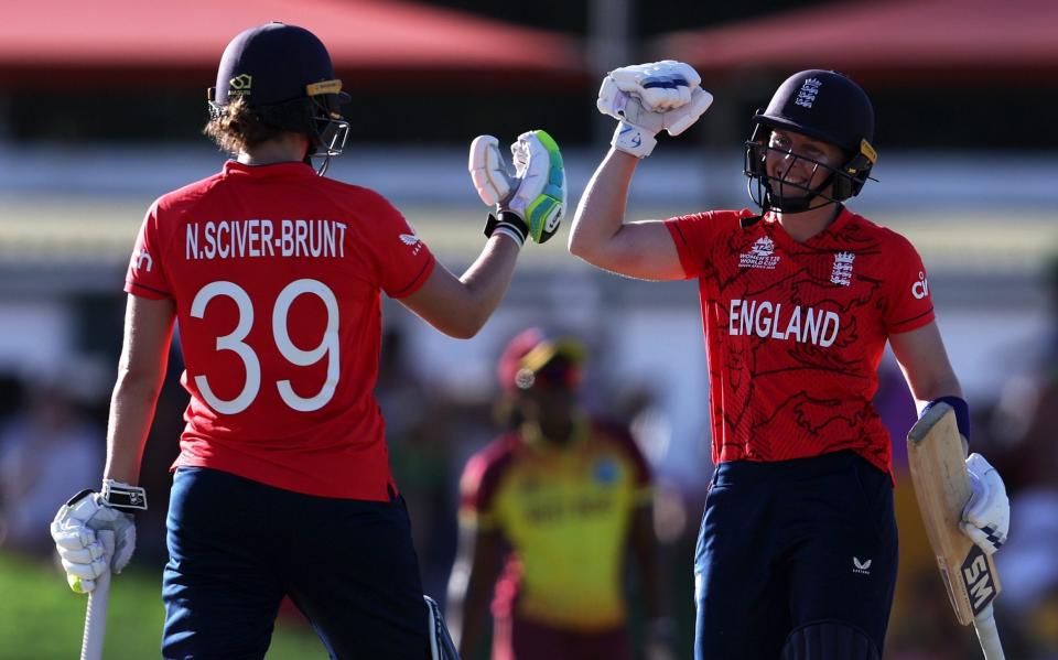 Heather Knight and Nat Sciver-Brunt of England celebrate following the ICC Women's T20 World Cup group B match between West Indies and England - Matthew Lewis/Getty Images