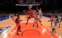 NEW YORK, NY - MARCH 09: Peyton Siva #3 of the Louisville Cardinals drives to the basket against Jack Cooley #45 and Scott Martin #14 of the Notre Dame Fighting Irish during the semifinals of the Big East men's basketball tournament at Madison Square Garden on March 9, 2012 in New York City. (Photo by Chris Trotman/Getty Images)