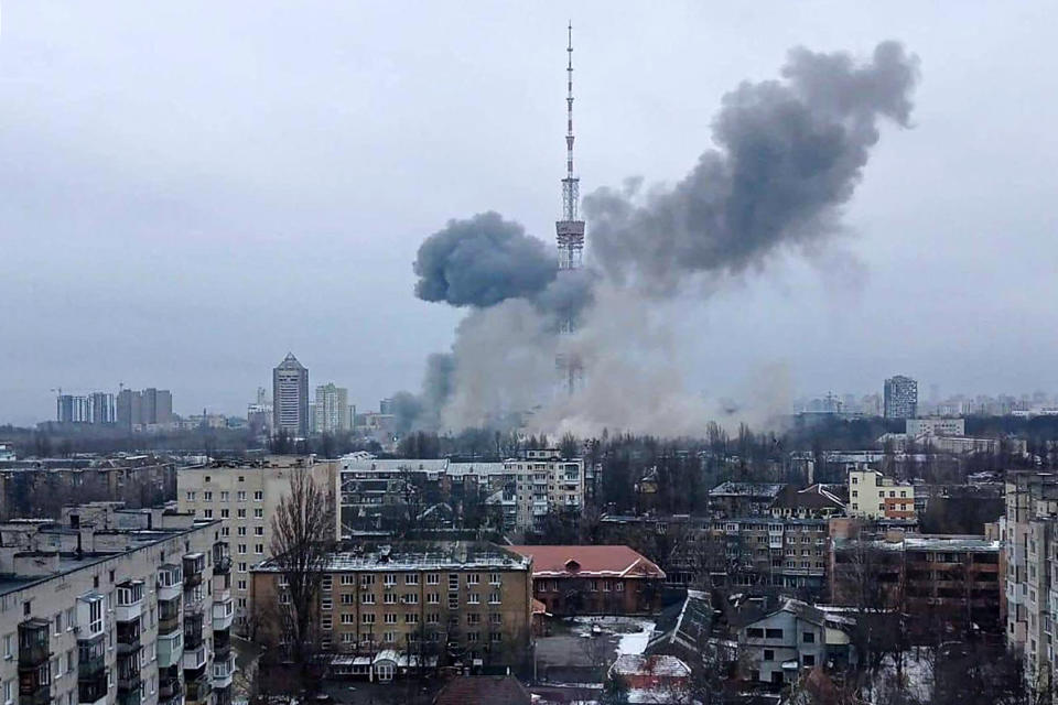 TOPSHOT - This handout picture released on the Facebook page of the Ukrainian Interior ministry  on March 1, 2022 show the smoke after a missile attack targeting the Ukrainian capital’s television centre in Kyiv.  - RESTRICTED TO EDITORIAL USE - MANDATORY CREDIT 