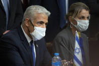 Israeli Foreign Minister Yair Lapid, meets with Egyptian Foreign Minister Sameh Shoukry at Tahrir Palace in Cairo, Egypt, Thursday, Dec. 9, 2021. (AP Photo/Nariman El-Mofty)