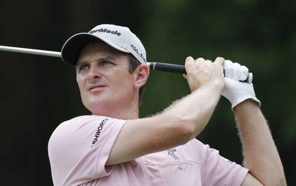 Justin Rose of England, hits from the 8th tee during the final round of The Players championship golf tournament at TPC Sawgrass, Sunday, May 11, 2014, in Ponte Vedra Beach, Fla. (AP Photo/Gerald Herbert)