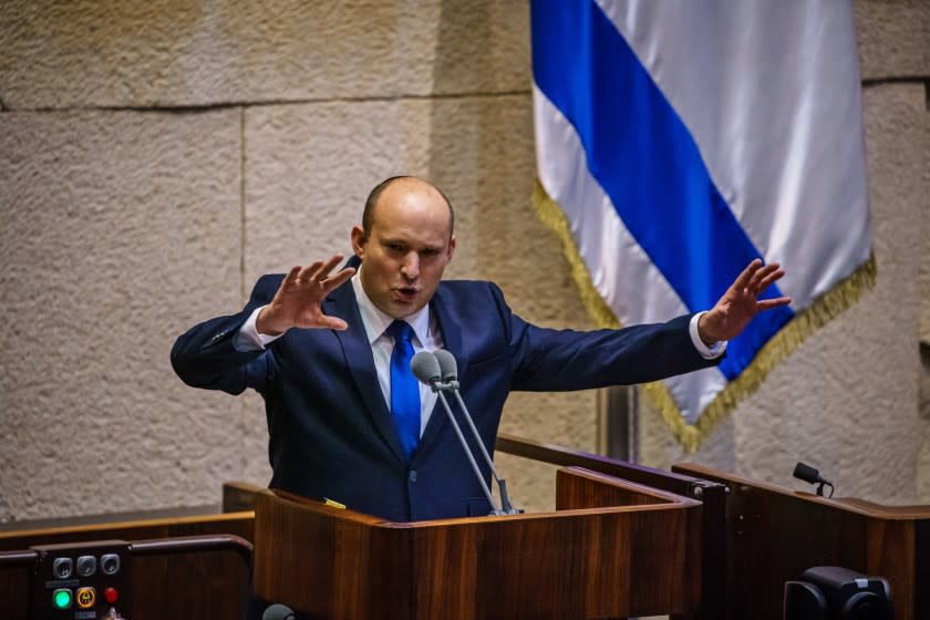 JERUSALEM, ISRAEL -- JUNE 13, 2021: Incoming Prime Minister Naftali Bennett addresses the Knesset, Israel's parliament, before the vote of confidence was cast confirming the new coalition government which unseated Benjamin Netanyahu as Prime Minister in Jerusalem, Israel, Sunday, June 13, 2021. (MARCUS YAM / LOS ANGELES TIMES)