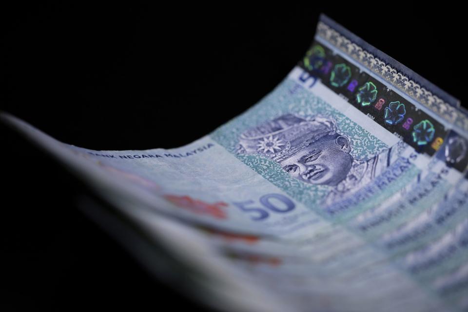 Malaysian fifty ringgit banknotes. Photographer: Kiyoshi Ota/Bloomberg