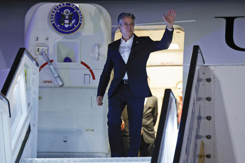 U.S. Secretary of State Antony Blinken gestures as he arrives in Tel Aviv, during his week-long trip aimed at calming tensions across the Middle East, Israel, Monday, Jan. 8, 2024. (Evelyn Hockstein/Pool Photo via AP)