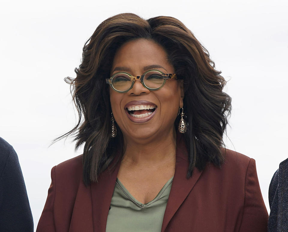 FILE - This March 25, 2019 file photo shows Oprah Winfrey during an event to announce new Apple products in Cupertino, Calif. Winfrey says she’s playing it safe when it comes to the rapidly spreading coronavirus. The 66-year-old entertainment icon said that she has been quarantining and practicing social distancing at her home. Winfrey has been busy working despite being stuck at home. She interviewed actor Idris Elba, who tested positive for the coronavirus, through FaceTime for an episode of "Oprah Talks: COVID-19" on Apple TV. (AP Photo/Tony Avelar, File)